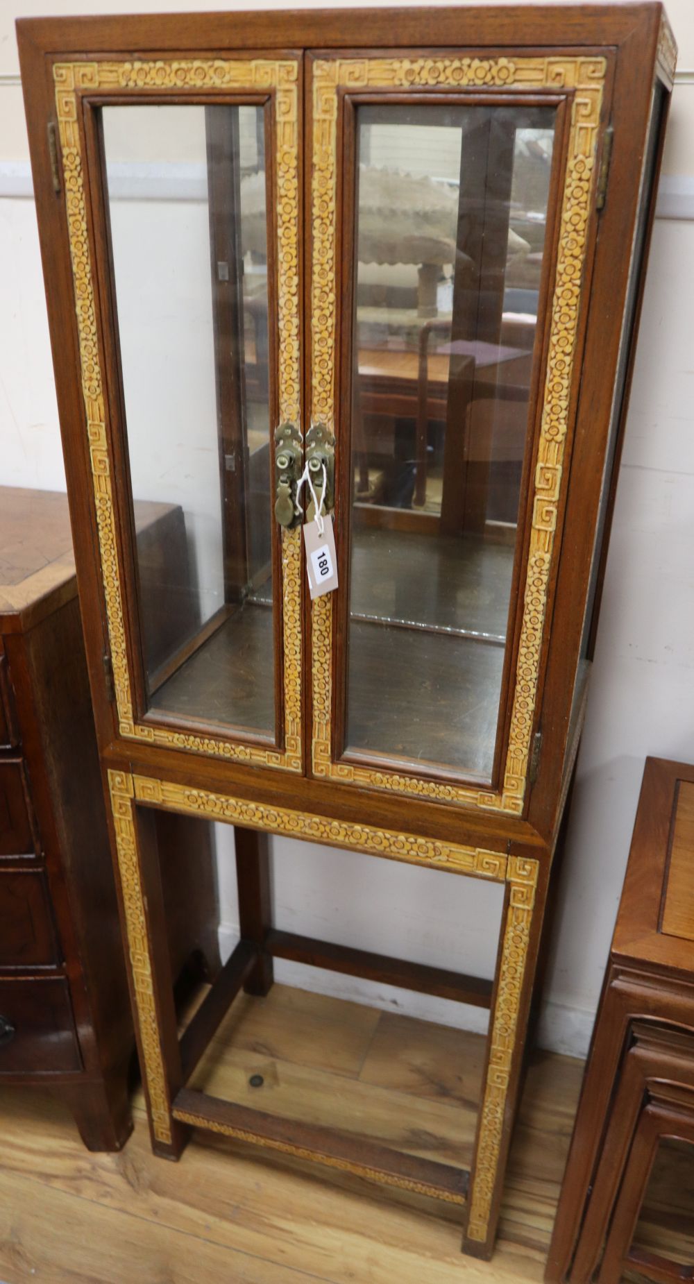 A Chinese hardwood display cabinet, width 51cm, depth 38cm, height 143cm